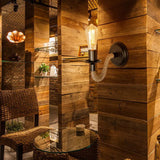 Industrielle LED Wandleuchte mit Juteseil und schwarzem Sockel