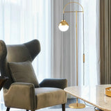 Gold Hanging Sphere Arched Floor Lamp